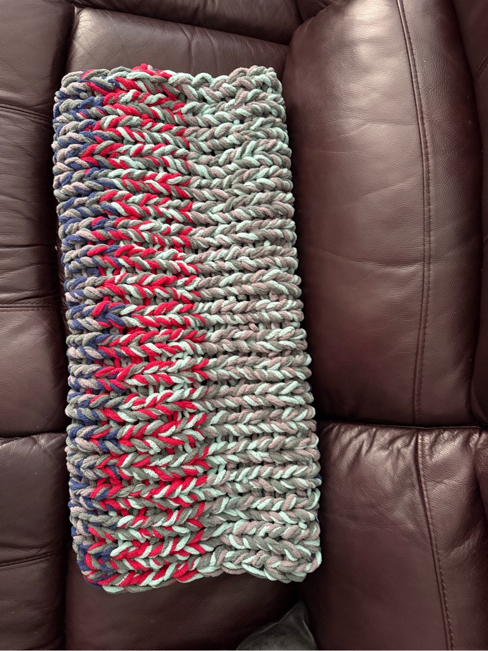 Handmade Chunky Knit baby blanket or pet bed. Light Gray with Red & Blue Accents